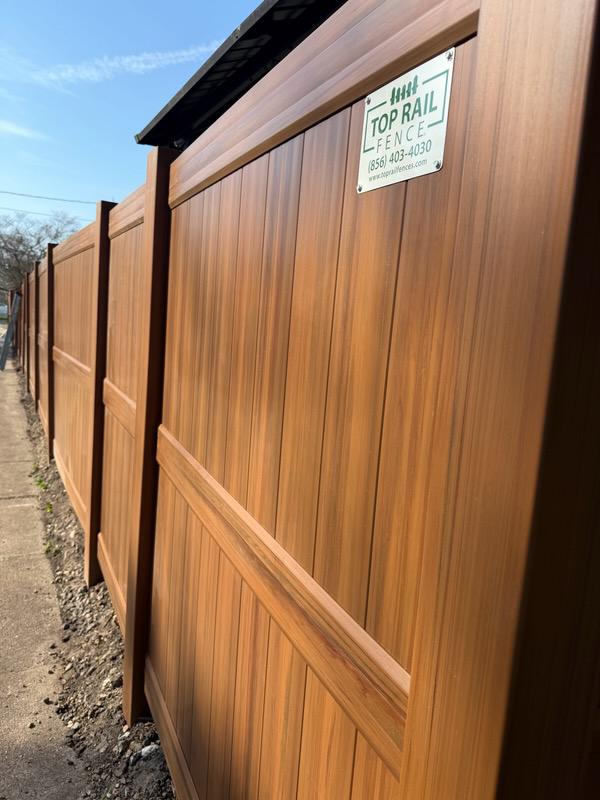 vinyl privacy fence installed by top rail fence