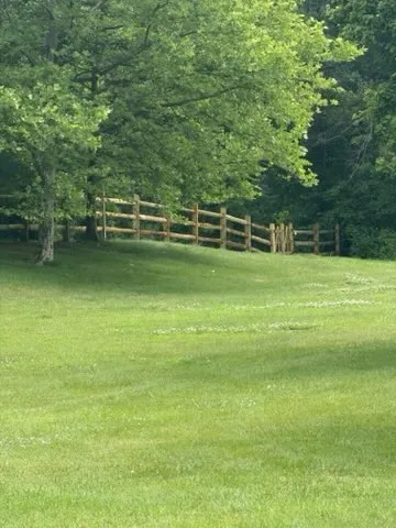 wood ranch rail fence installed by top rail fence
