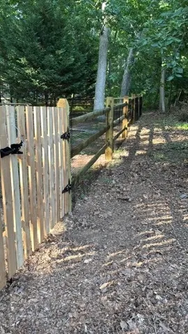 wood ranch rail fence installed by top rail fence