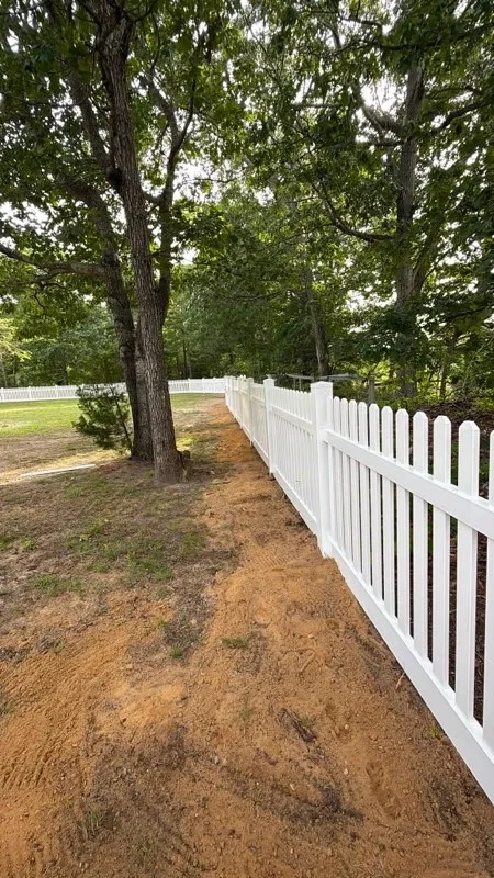 vinyl picket fence installed by top rail fence
