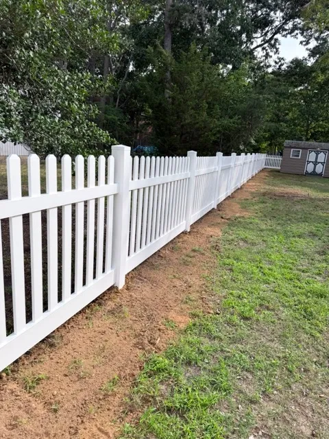 vinyl picket fence installed by top rail fence