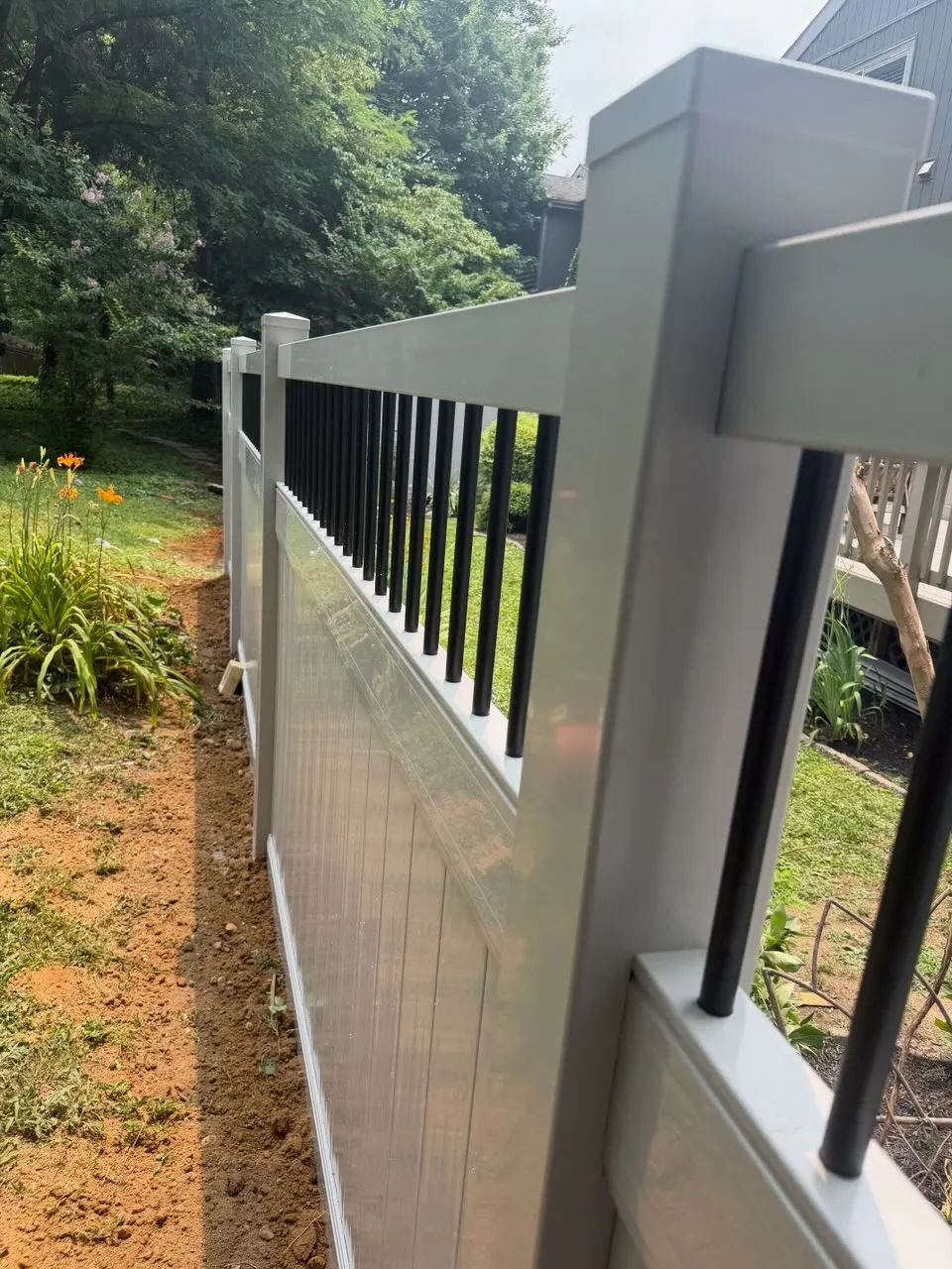 Vinyl decorative top privacy fence installed by top rail fence