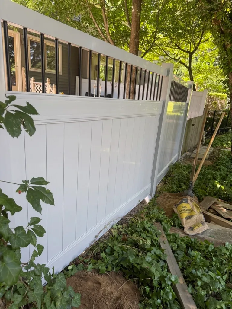 Vinyl decorative top privacy fence installed by top rail fence