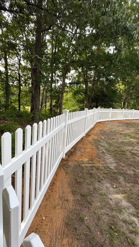 vinyl picket fence installed by top rail fence