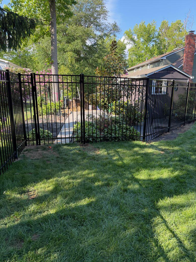 three rail ornamental metal fence installed by top rail fence