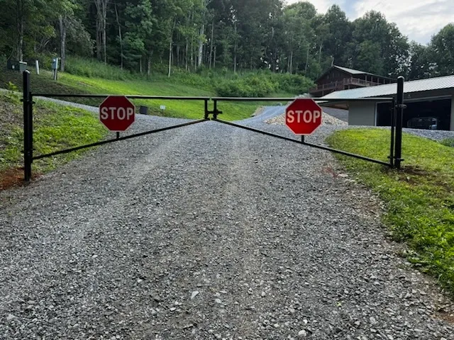 metal gate installed by top rail fence