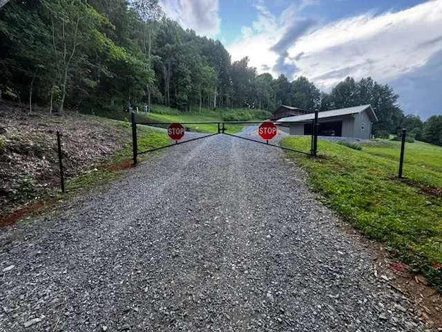 metal gate installed by top rail fence