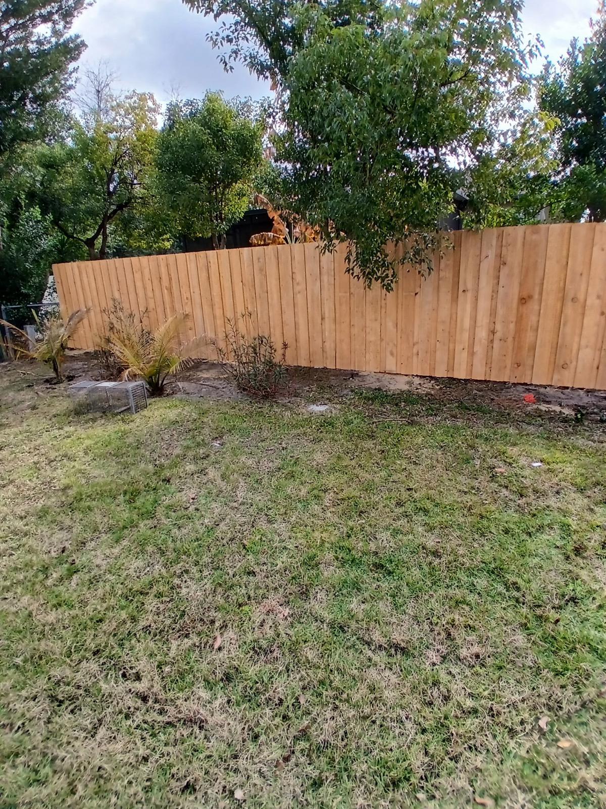 wood board on board fence installed by the top rail fence