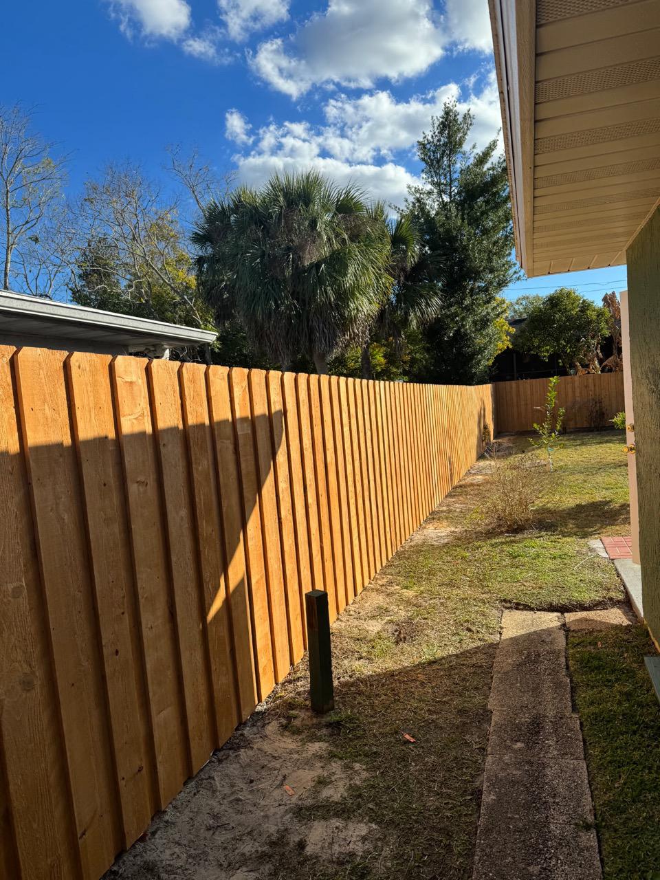 wood board on board fence installed by top rail fence