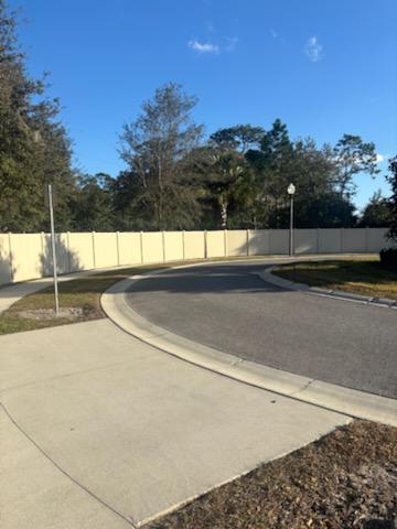 privacy vinyl fence installed by top rail fence