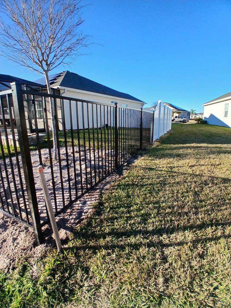 ornamental metal fence installed by top rail fence