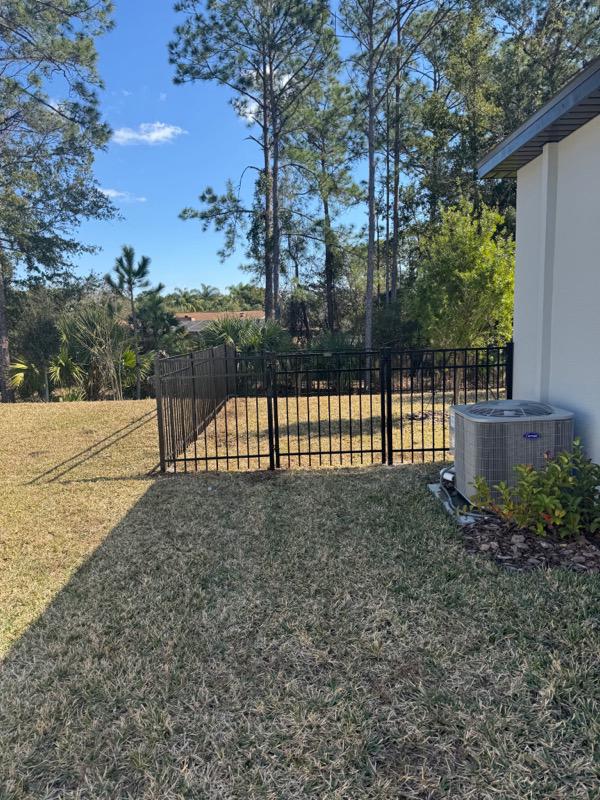 ornamental metal fence installed by top rail fence