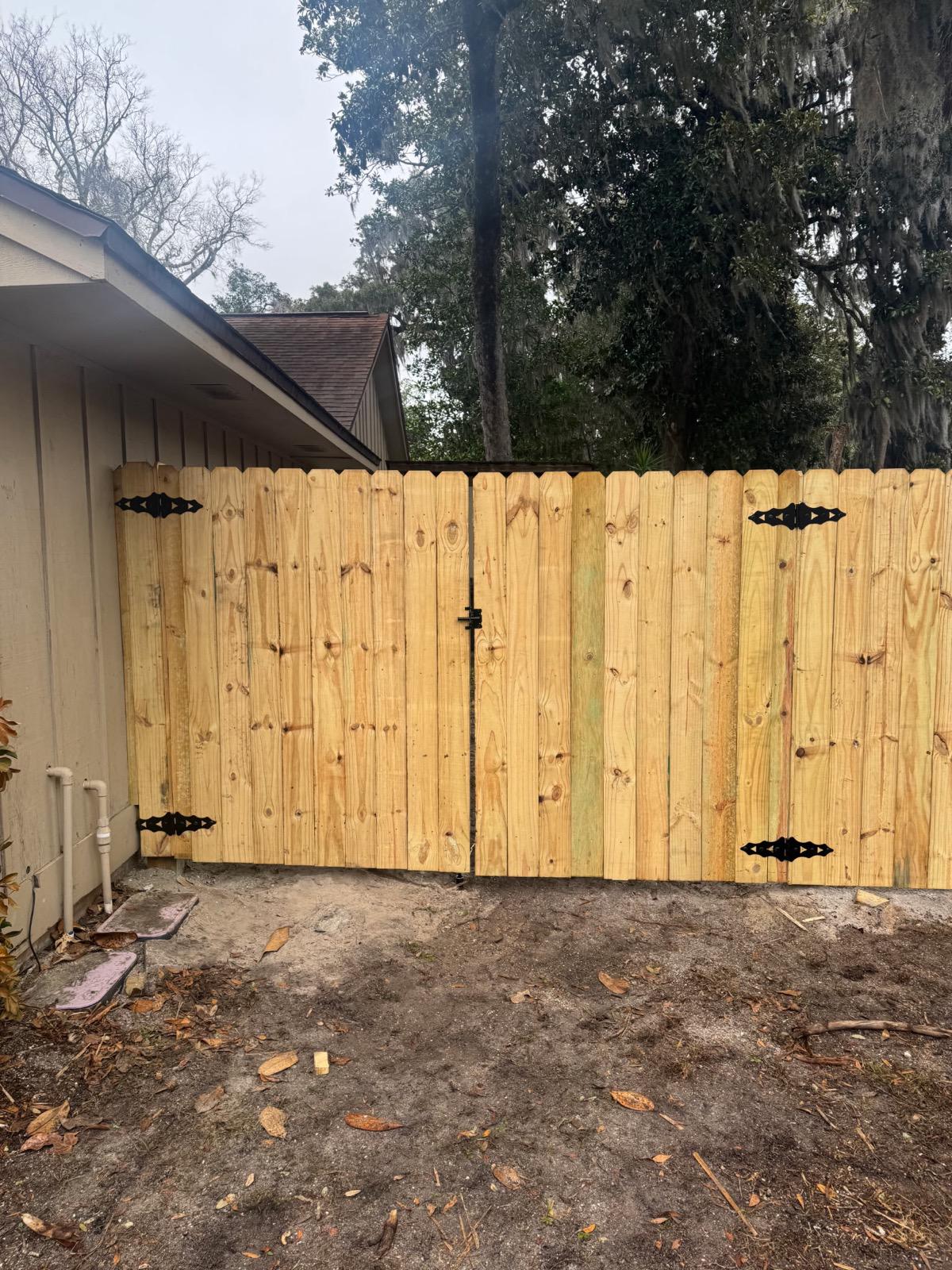 wood stockade fence installed by top rail fence