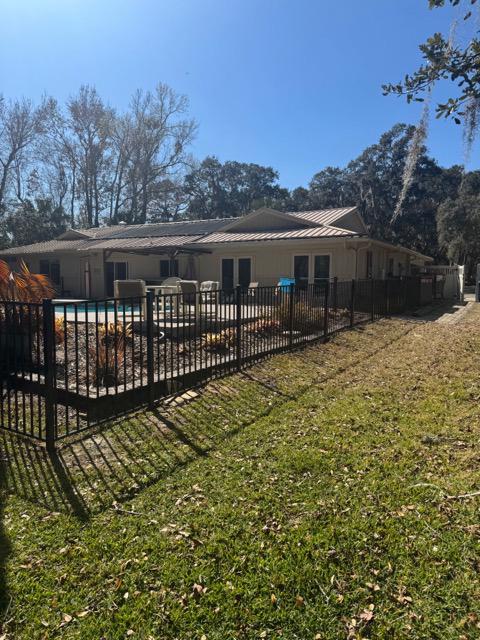  ornamental metal fence installed by top rail fence