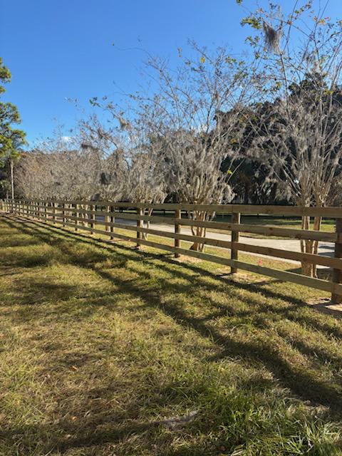 wood horizontal fence installed by top rail fence