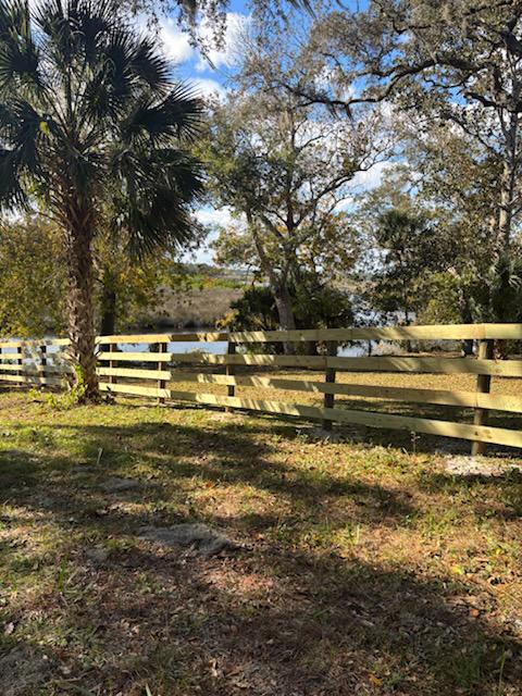 wood horizontal fence installed by top rail fence