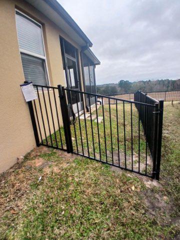 ornamental horizontal fence installed by top rail fence