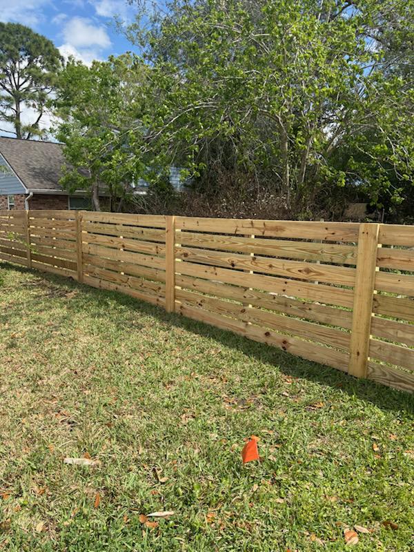 wood horizontal fence installed by top rail fence