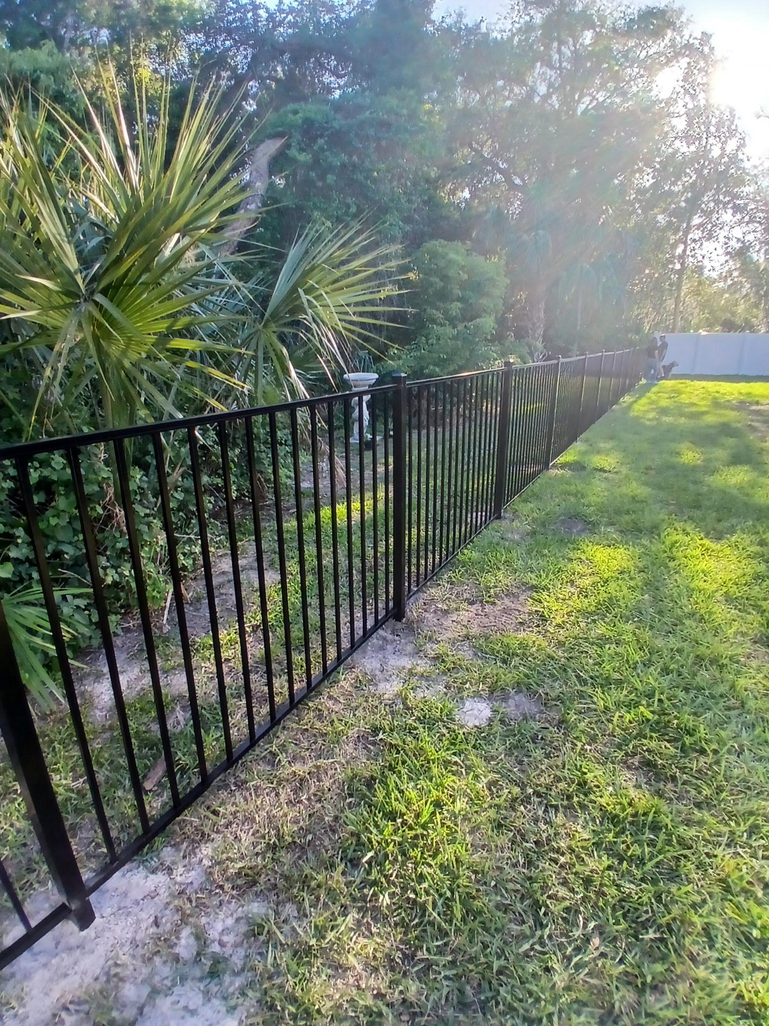 ornamental horizontal fence installed by top rail fence