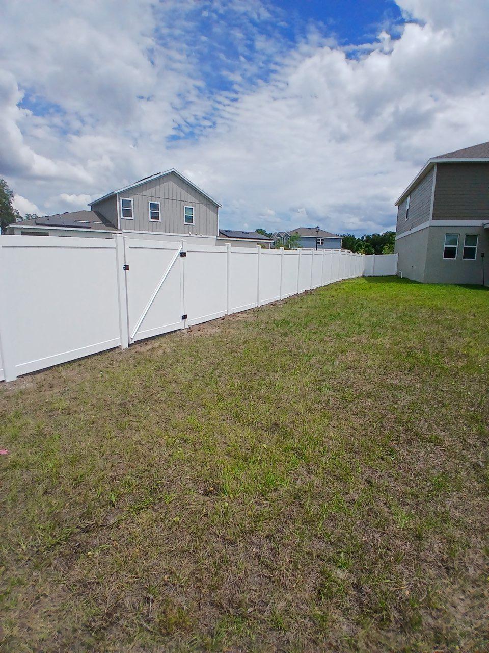 vinyl privacy fence installed by top rail fence
