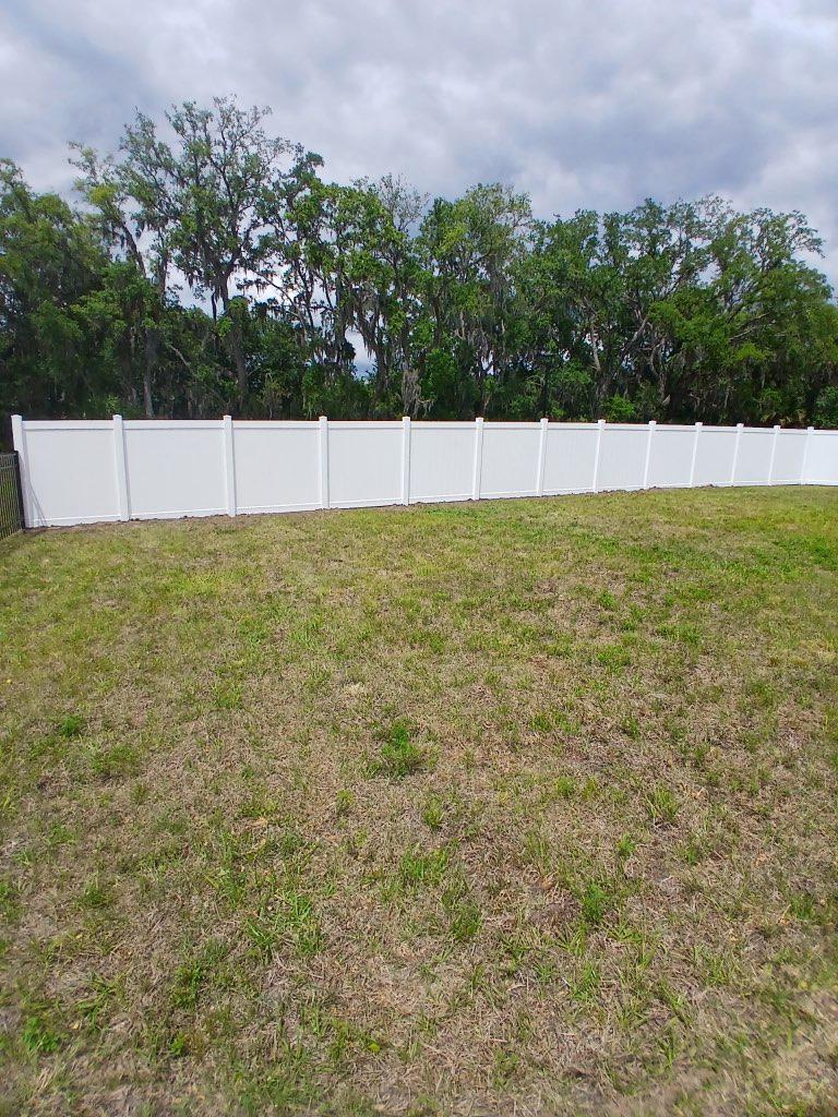 vinyl privacy fence installed by top rail fence