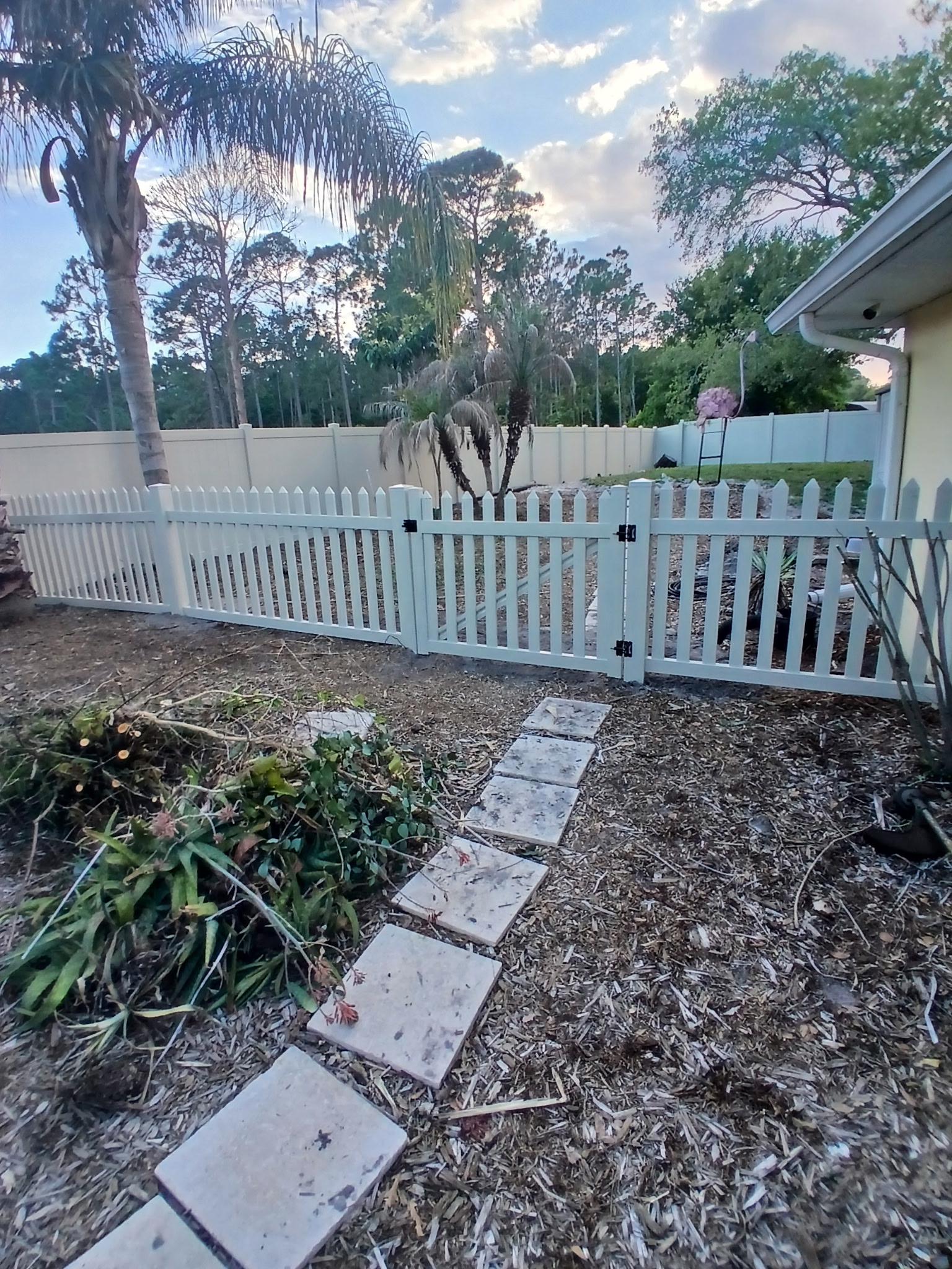 vinyl gate installed by top rail fence