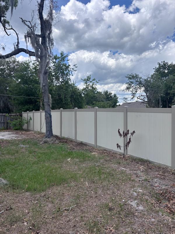 vinyl privacy fence installed by top rail fence