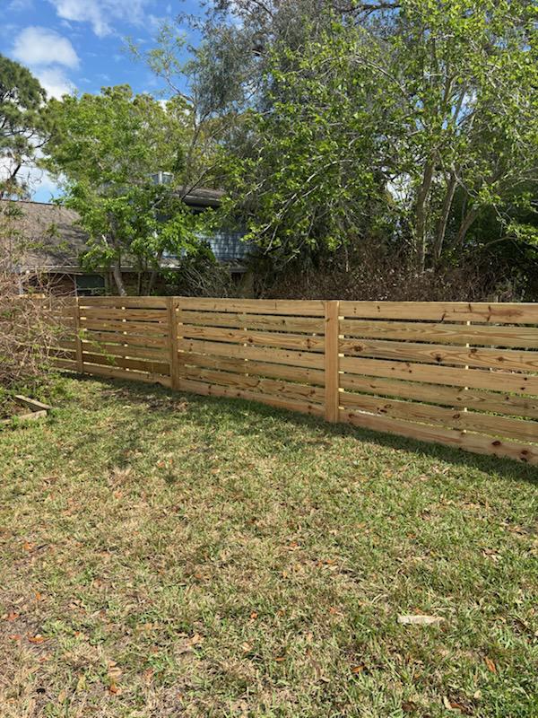 wood horizontal fence installed by top rail fence