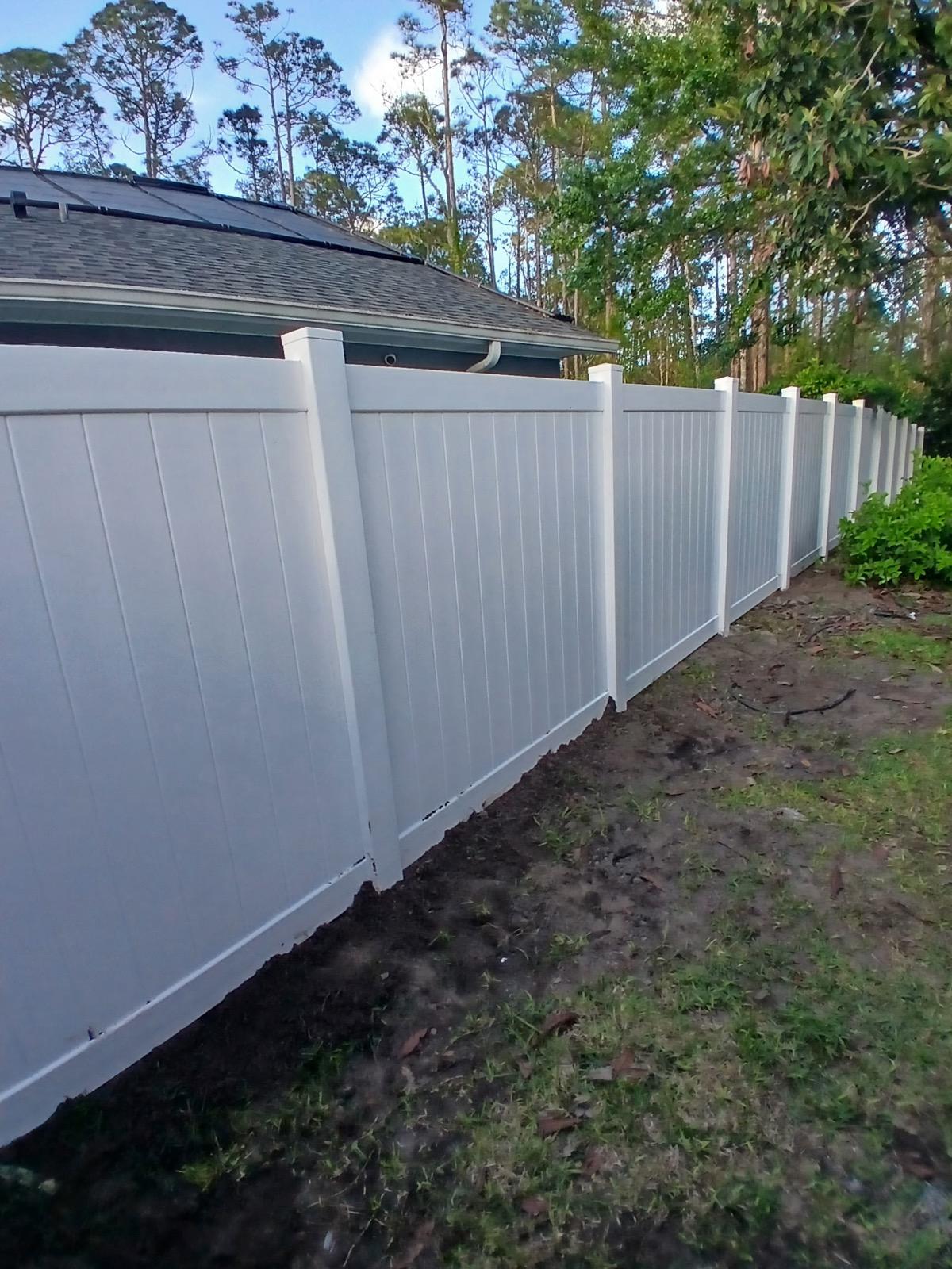 vinyl privacy fence installed by top rail fence