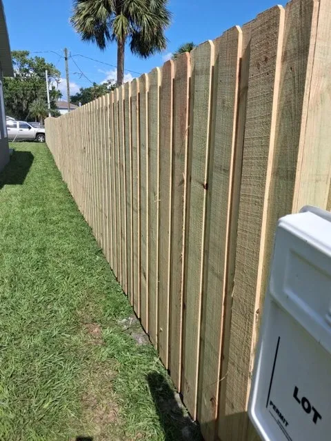 wood board on board fence installed by top rail fence
