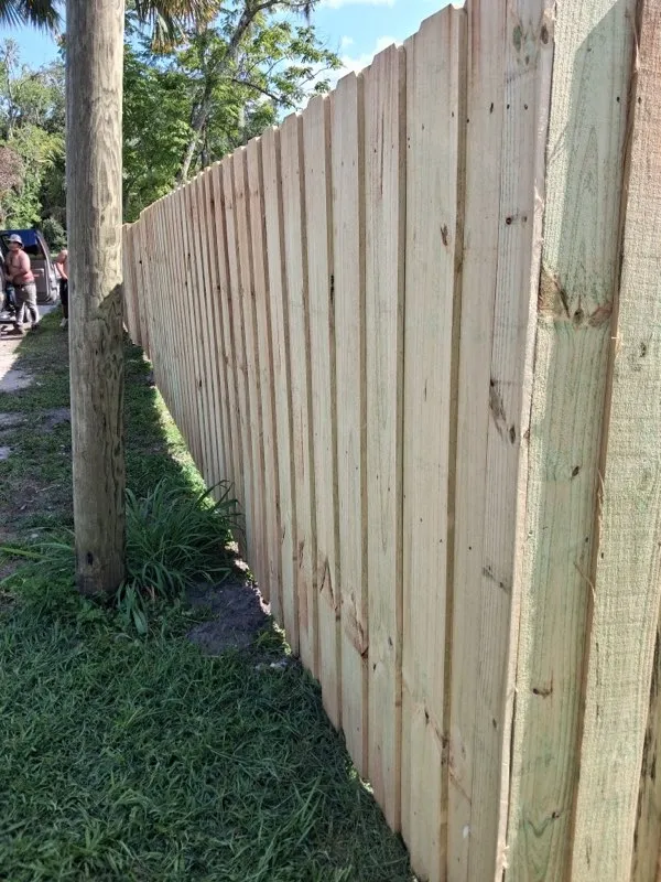wood board on board fence installed by top rail fence