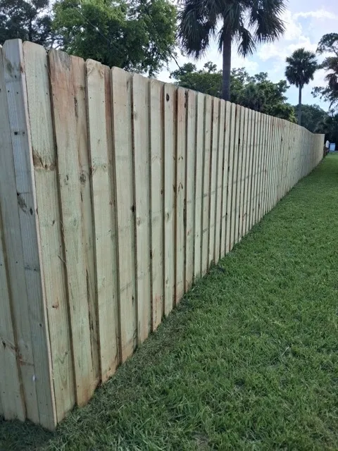 wood board on board fence installed by top rail fence