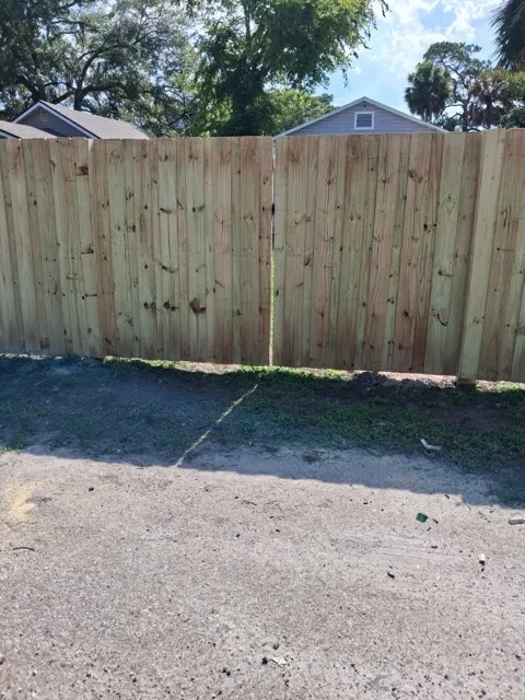 wood board on board fence installed by top rail fence
