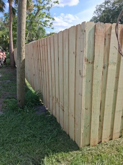 wood board on board fence installed by top rail fence
