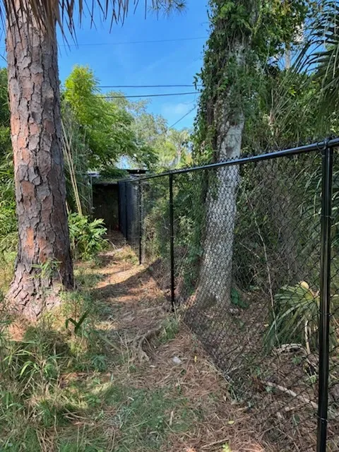 black chain link fence installed by top rail fence