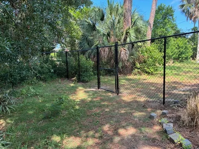 black chain link fence installed by top rail fence
