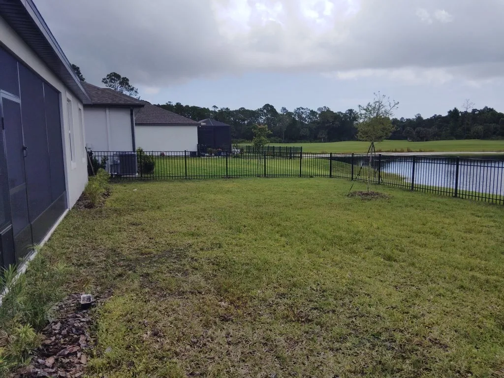 three rail ornamental metal fence installed by top rail fence