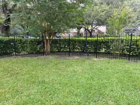 three rail ornamental metal fence installed by top rail fence