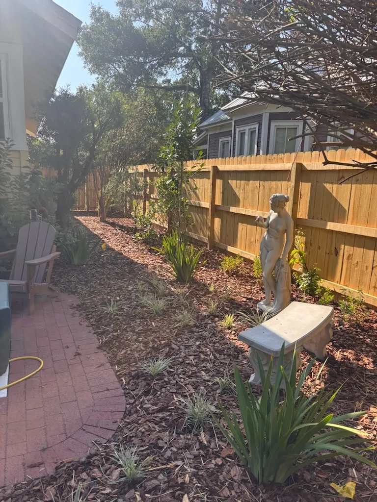 wood stockade fence installed by top rail fence
