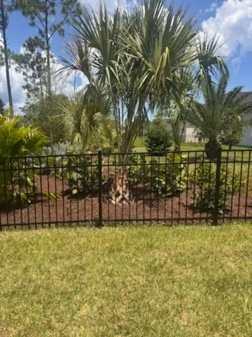 three rail ornamental metal fence installed by top rail fence