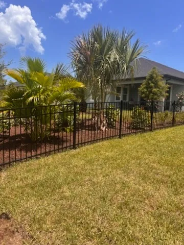 three rail ornamental metal fence installed by top rail fence