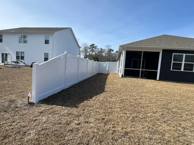 vinyl privacy fence installed by top rail fence