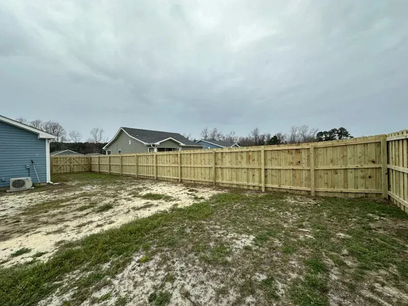 wood board on board fence installed by top rail fence