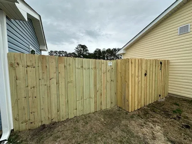 wood board on board fence installed by top rail fence