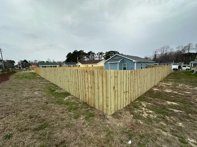 wood board on board fence installed by top rail fence