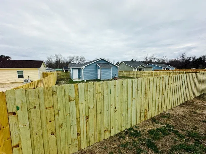 wood board on board fence installed by top rail fence