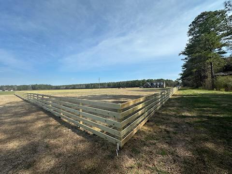 wood horizontal fence installed by top rail fence