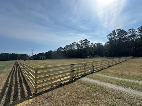 wood ranch rail fence installed by top rail fence