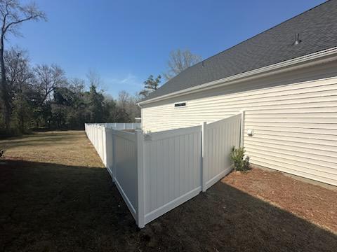 vinyl privacy fence installed by top rail fence