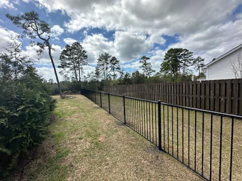 ornamental metal fence installed by top rail fence
